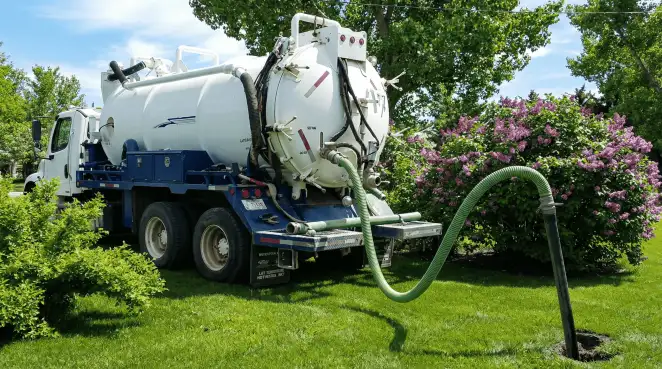 Professional vacuum truck performing residential drainage and septic maintenance in Louisville, KY